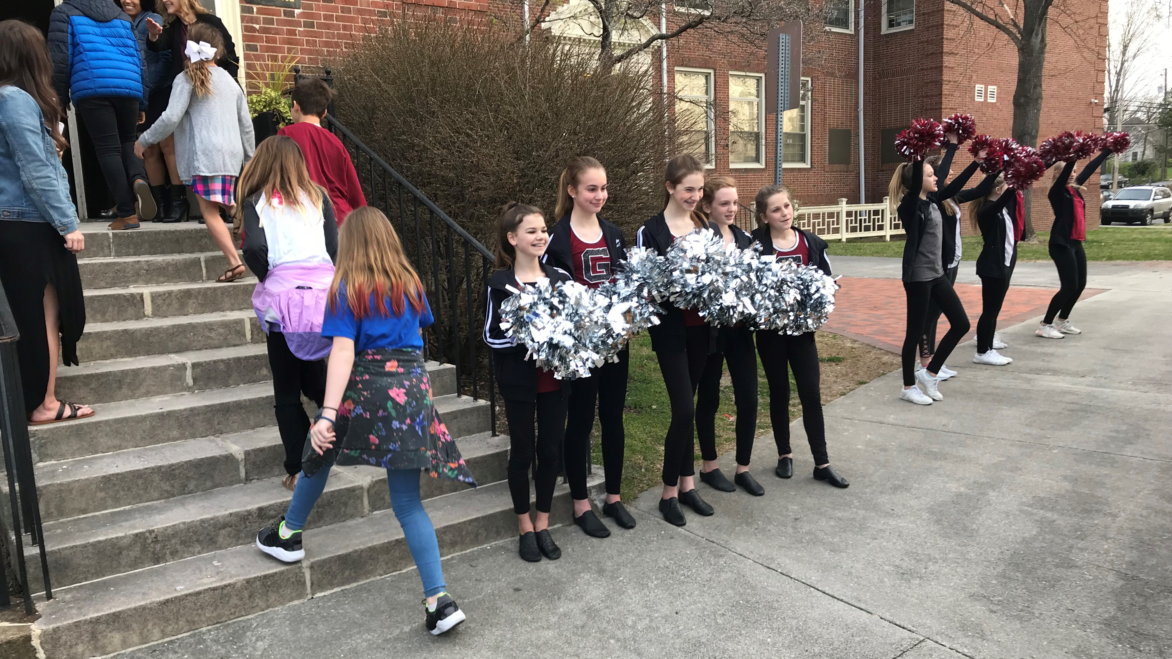 Members of the cheerleading and dance teams greet rising 6th-graders during an orientation session at Gresham Middle School. 